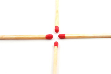 Some red matches isolated on a white background.