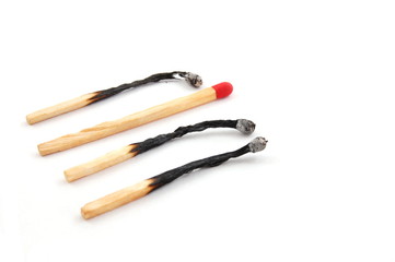 Some red matches isolated on a white background.