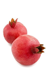 two pomegranates isolated on white