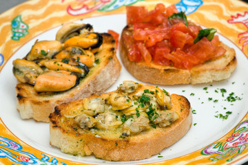 Tomato, clams and mussel Bruschetta  with olive oil