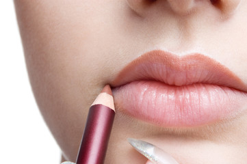make up, applying lips liner pencil
