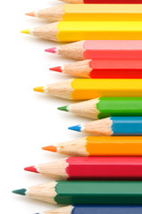 colorful pencils on white background