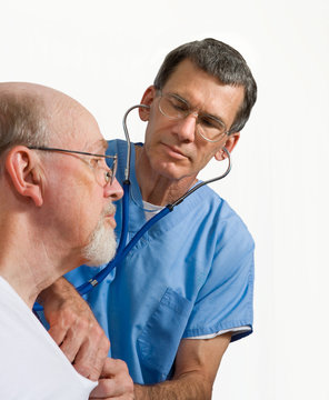 Male Doctor Or Nurse Examining Older Man