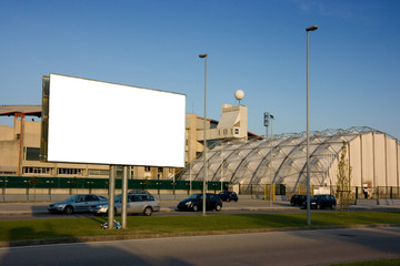Blank billboard on the street outside a stadium - 9414385