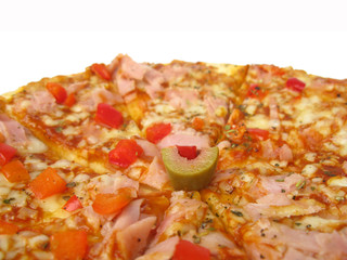 Pizza with ham, paprika and olives isolated on white