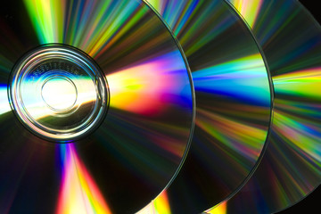 Compact discs raw reflecting ray of color