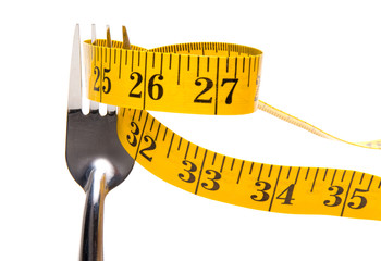 A tailor's measuring tape on a dinner fork.