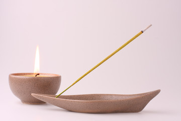 Still life with candle and incense stick in pastel shades - 9420347