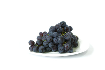 Ripe black grapes isolated on white background