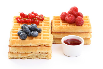 delicious waffles with various fruits isolated on white