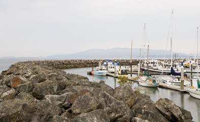 Fototapeta na wymiar A stone sea wall around a fishing harbor