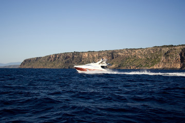 Obraz premium The motorboat drives fast on the sea.