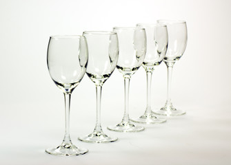 Empty cognac glasses set isolated on white background B&W
