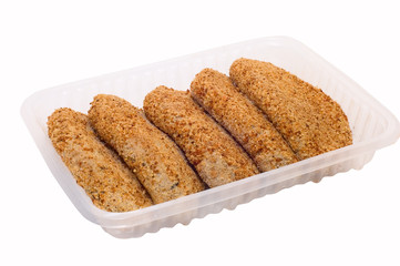 Half-finished: fish cakes at plate on white