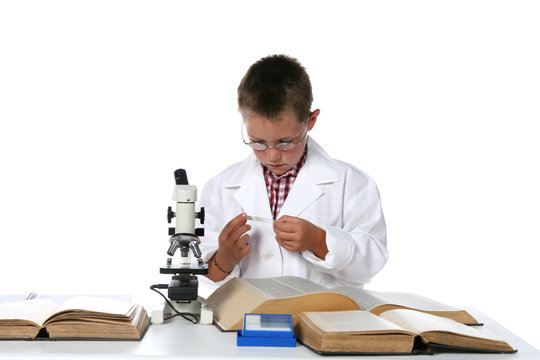 Child Scientist Looking At Slide For The Microscope