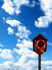 lifebuoy on the cloudy background