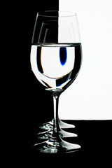 the refraction of the scene in goblet with water.