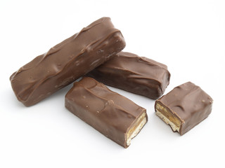 chocolate candy bars with peanuts isolated on white background