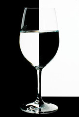 the refraction of the scene in goblet with water.
