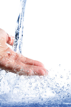 Pouring water splashing on hand