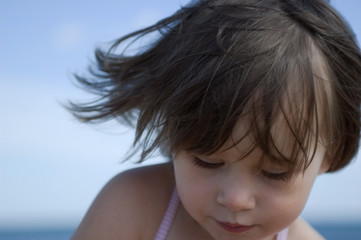 sweet little girl on the beach. summertime
