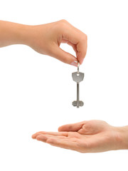 Hands and key isolated on white background