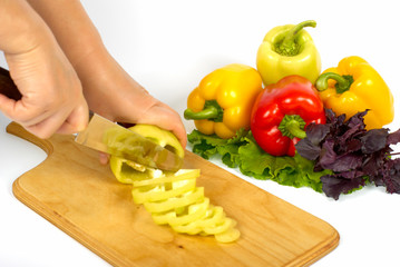 Cooking peppers on cutting boards with stainless knife