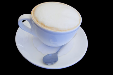 cup of cappuccino isolated on black