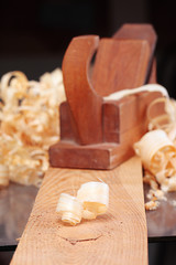 shaving and old wooden plane,focus on a foreground