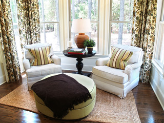 Two comfortable overstuffed chairs in a luxury sunroom