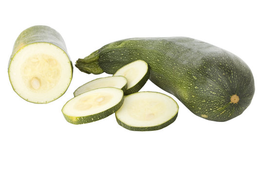 Ripe zucchinis or courgettes isolated on a white background