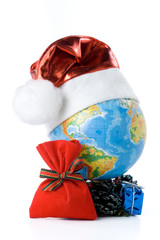 The globe in a Christmas cap on a white background.