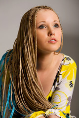 blond woman with the braids on a white background