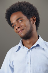 Portrait of young african american man with pleased expression