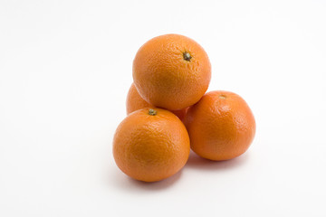four fresh and sweet mandarines over white background