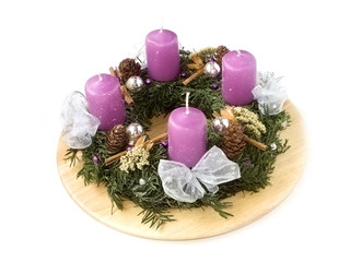 Christmas wreath with candles isolated on white background
