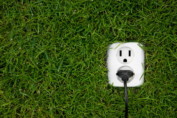 energy concept outlet in grass