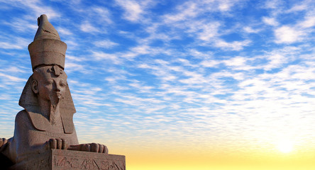 Antique Egyptian sphinx on quay of the river.