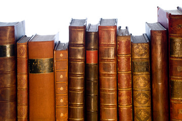 Row of antique leather books isolated on a white background
