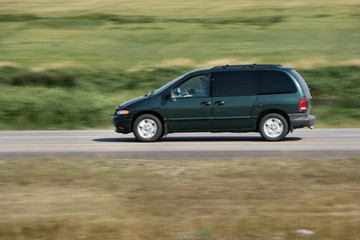 Obraz na płótnie Canvas Van vehicle in motion. Speed blur. Road abstract.