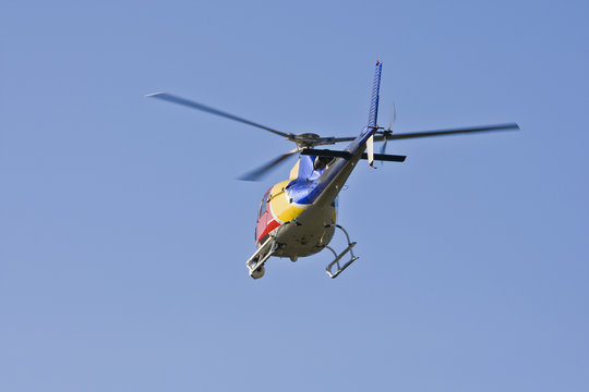 A helicopter with a camera. A motion blur on rotor blades