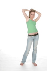 sexy woman in low rise jeans with her hands over her head