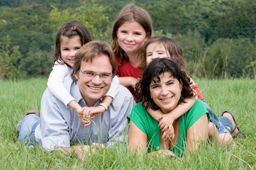 Fototapeta premium Happy and young family in a farmer´s field