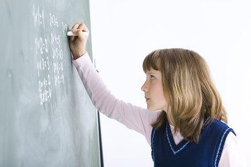 Schoolgirl at the chalkboard