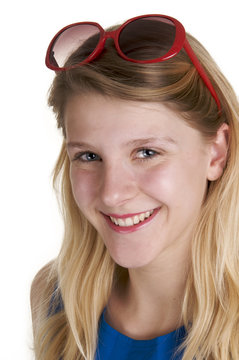a smiling blond woman with sunglasses against white background