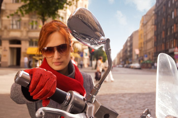 Beautiful woman on the motorcycle (focus on the hand)