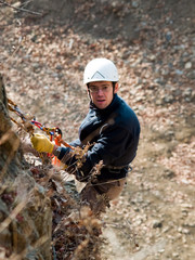 climber on the wall with tired face