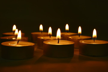 Fototapeta na wymiar Candles in darkness