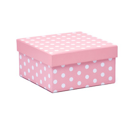 close pink gift box with white polka dots isolated on white