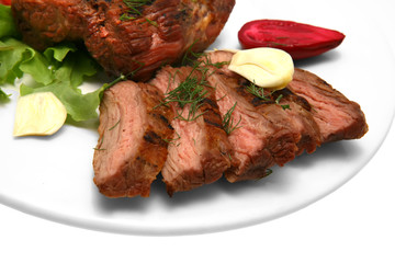 served roasted beef steak on color dish